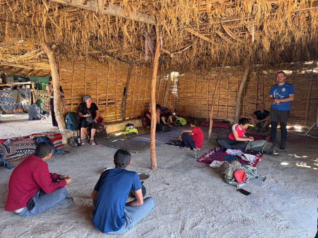 Hikers resting together in a shaded local shelter