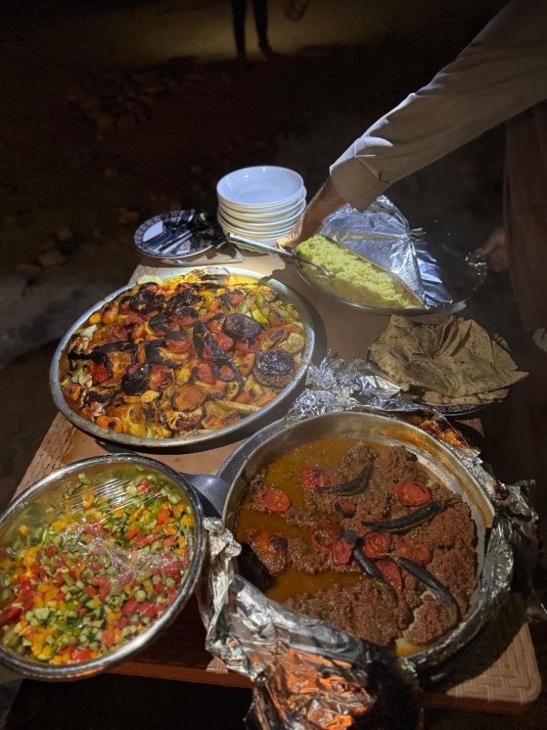 Freshly prepared Jordanian dishes served at a trail camp dinner