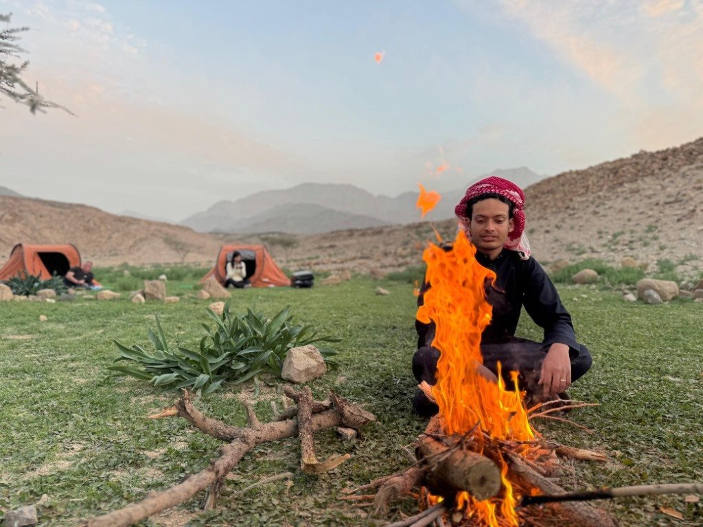 Morning campfire beside tents on the Jordan Trail