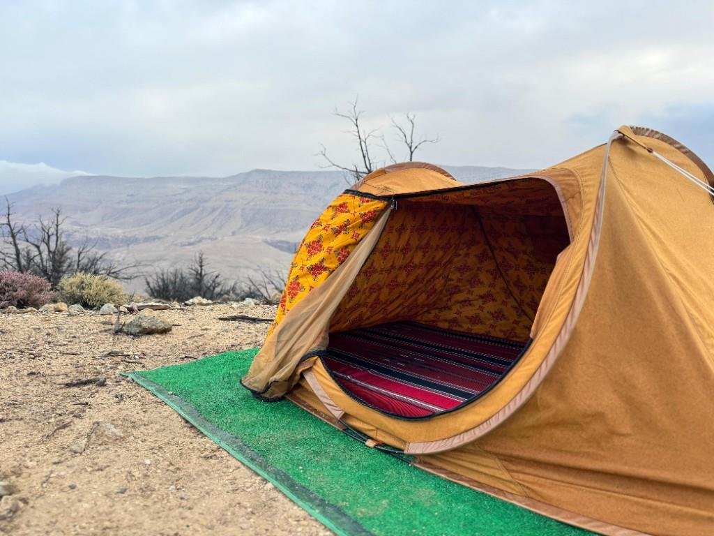 Dome tent overlooking arid mountains on the Jordan Trail